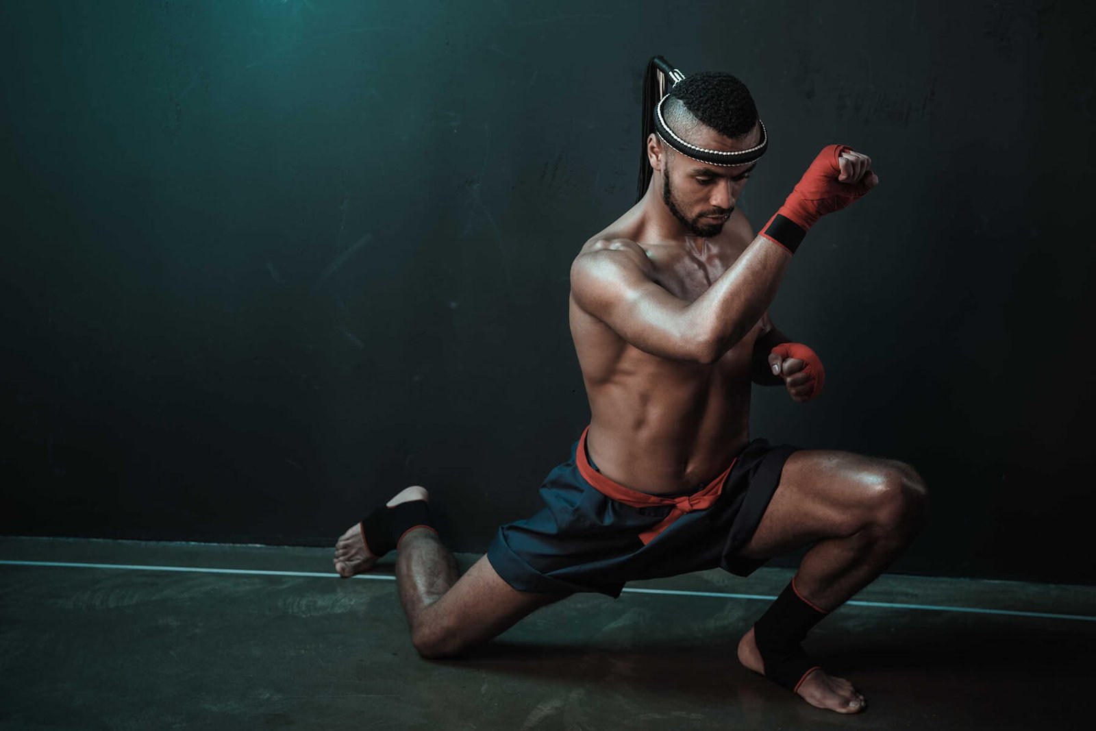 muay-thai-athlete-training-at-thai-boxing-indoors-HP3RAWL.jpg